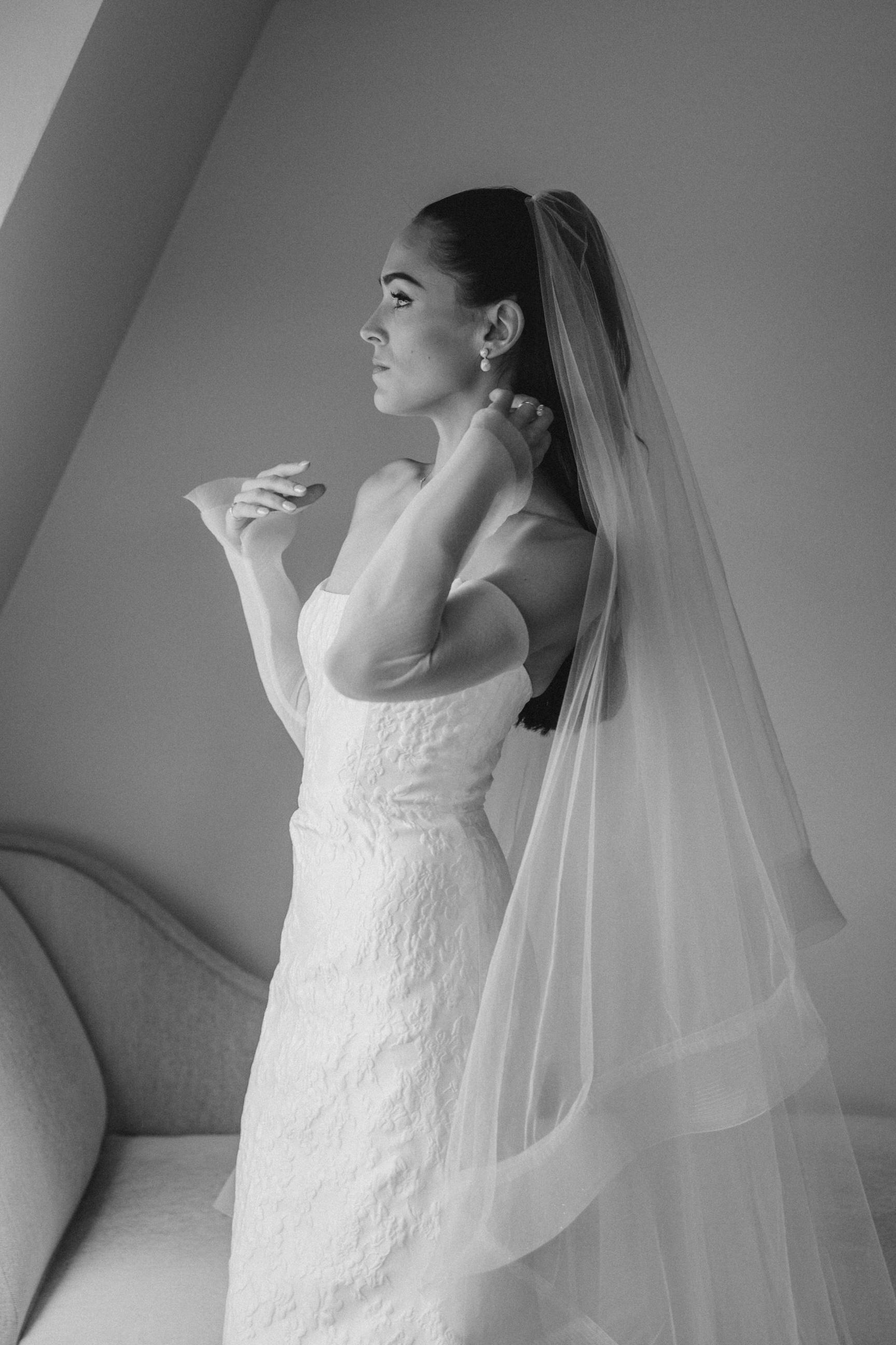 cascading horsehair edge bridal veil on bride wearing tulle gloves